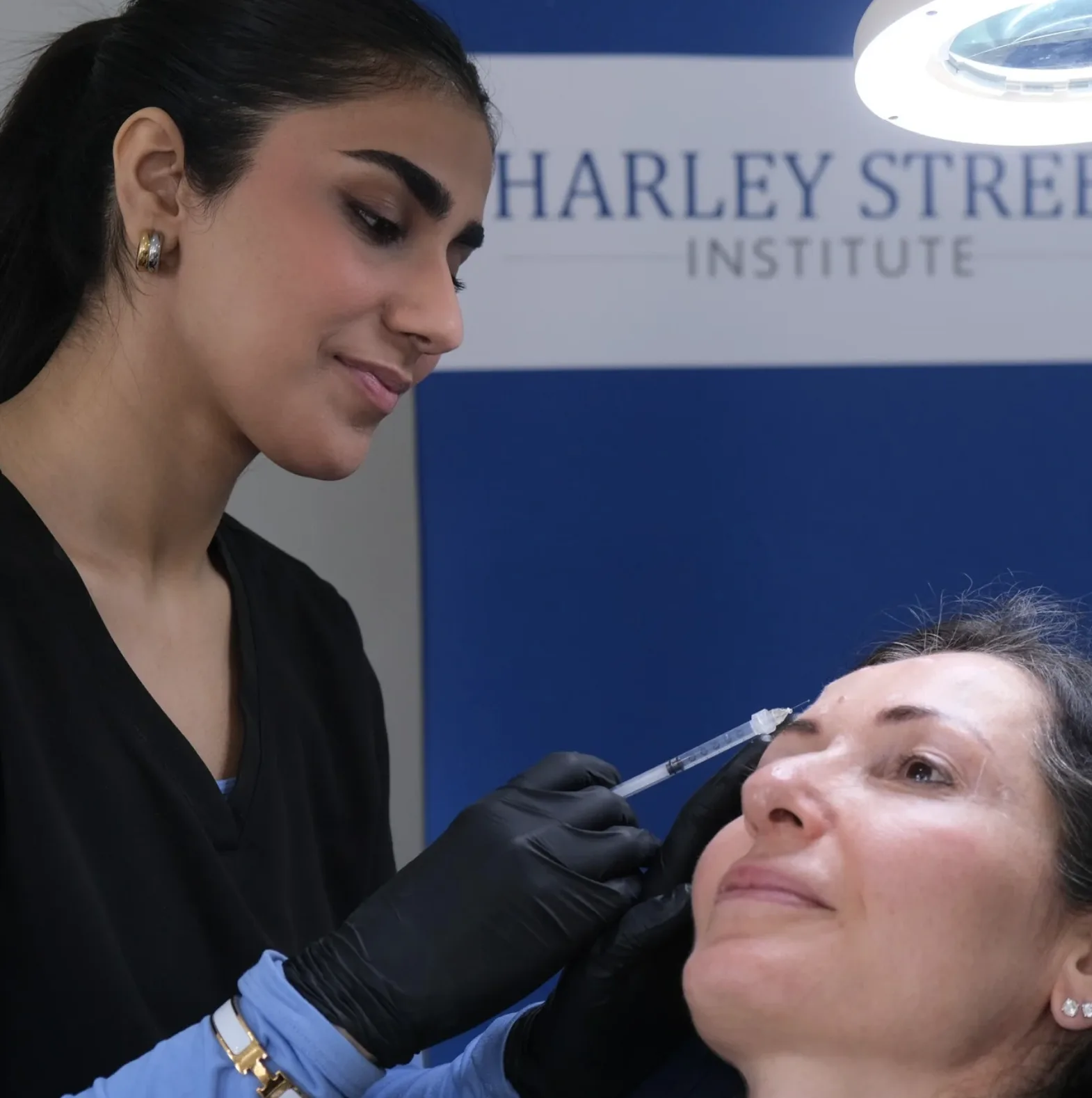 Dr. Khadija - Aesthetic Medicine Specialist performing treatment in Karachi