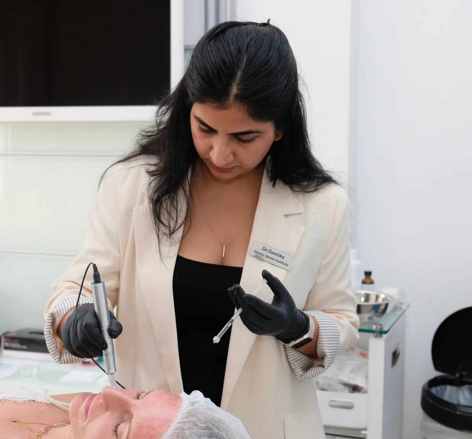 Dr. Geetika performing advanced aesthetic treatments