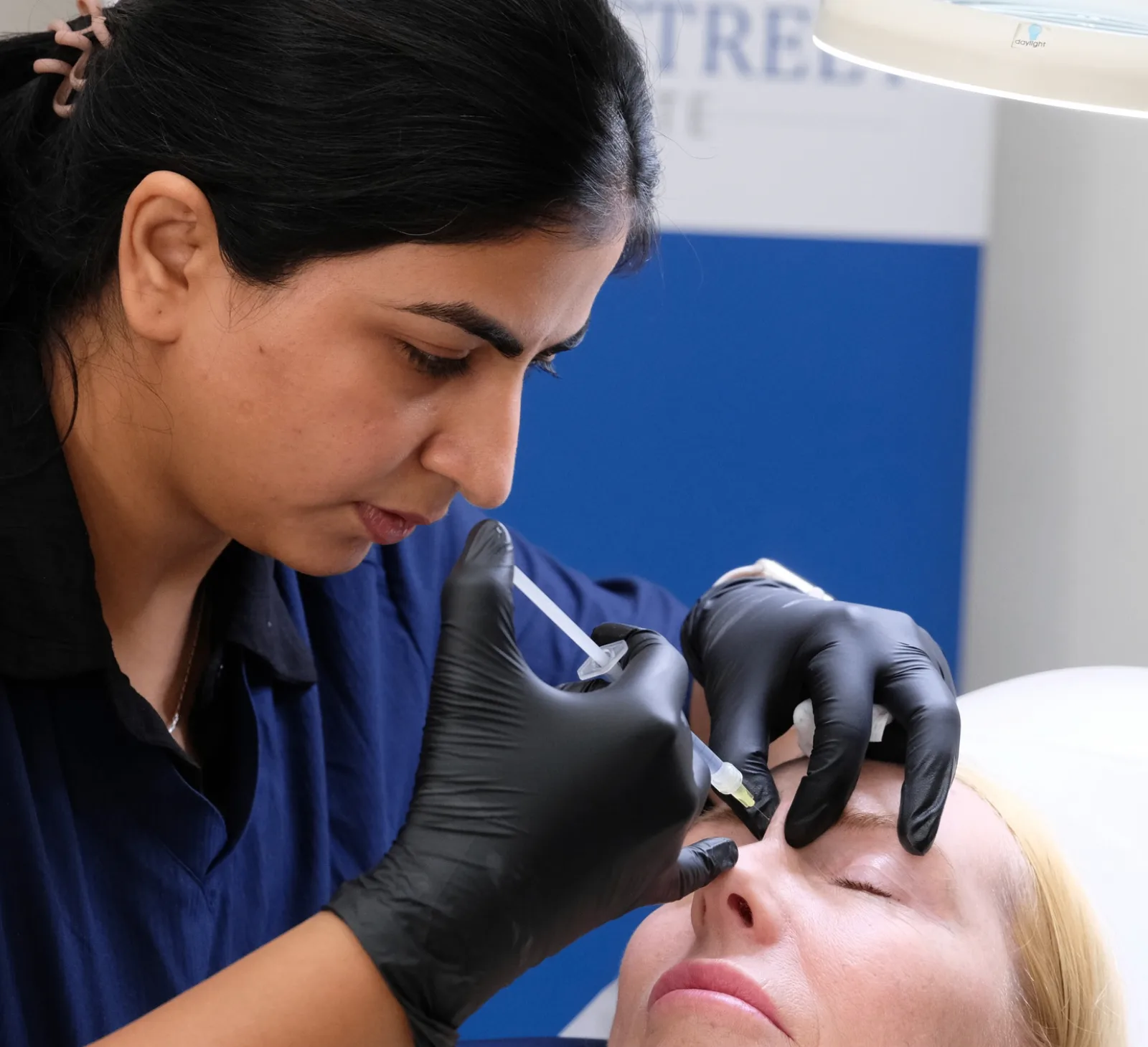 Dr. Geetika performing advanced aesthetic procedure