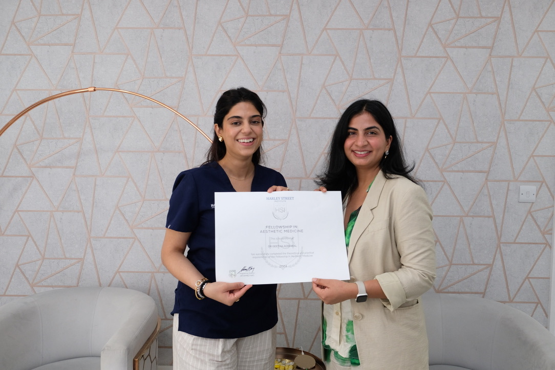 Fellowship graduates receiving aesthetic medicine certification from Harley Street Institute