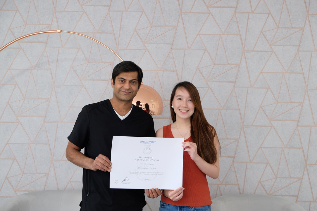 Medical professionals celebrating completion of aesthetic medicine fellowship training programme